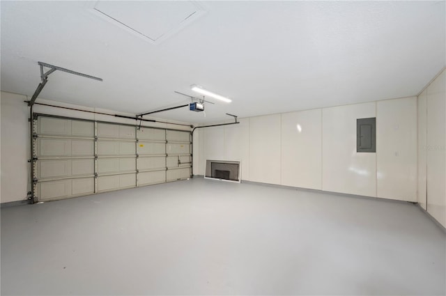 garage featuring a garage door opener and electric panel