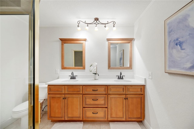 full bath with ornamental molding, toilet, double vanity, and tile patterned flooring