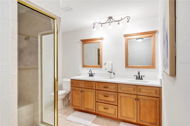 full bath featuring a tile shower, double vanity, tile patterned flooring, and toilet