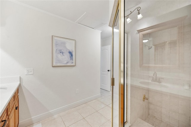 full bathroom featuring tile patterned floors, a stall shower, vanity, and baseboards