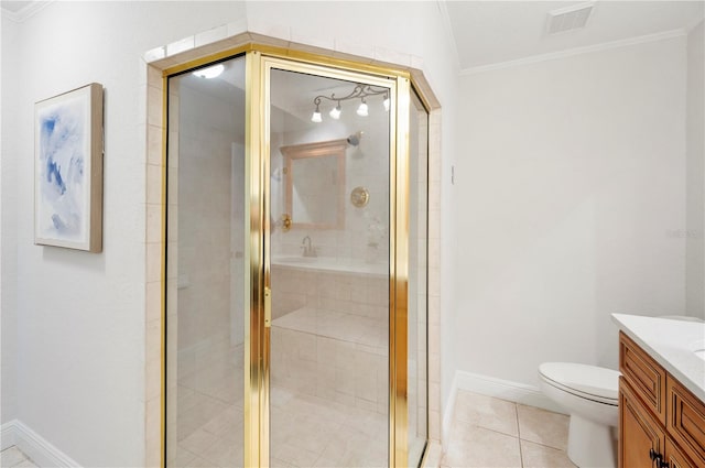 bathroom with crown molding, vanity, a stall shower, tile patterned flooring, and toilet