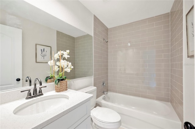 bathroom with shower / bathtub combination, toilet, and vanity