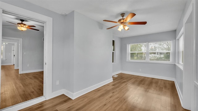 unfurnished room featuring ceiling fan and light hardwood / wood-style flooring