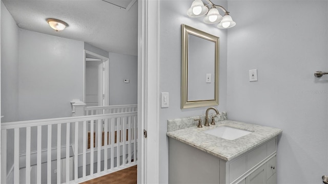 bathroom featuring vanity and a textured ceiling