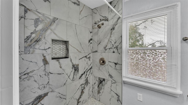 bathroom featuring a tile shower