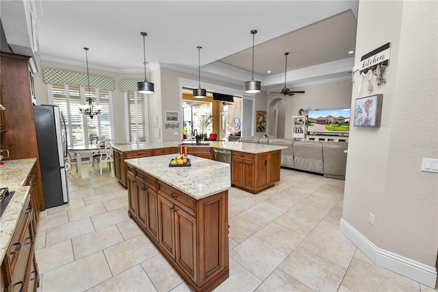 kitchen featuring pendant lighting, ornamental molding, a center island, kitchen peninsula, and stainless steel appliances