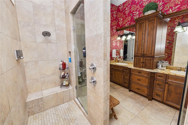 bathroom with vanity, tile patterned flooring, and a shower with shower door