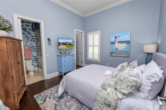 bedroom with ornamental molding, dark hardwood / wood-style floors, and ensuite bathroom