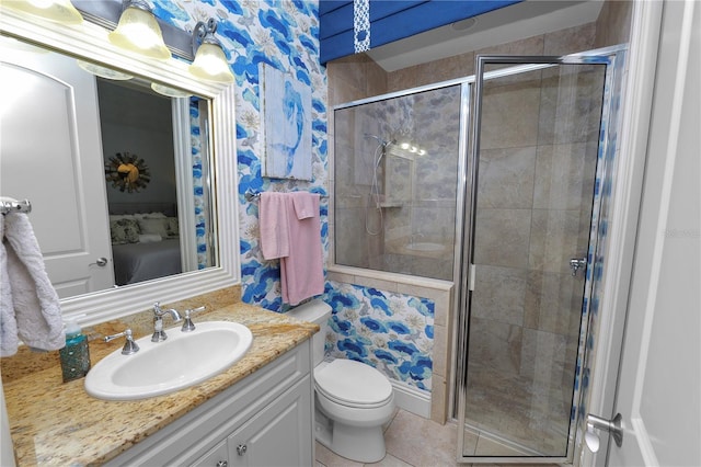 bathroom with vanity, toilet, an enclosed shower, and tile patterned flooring