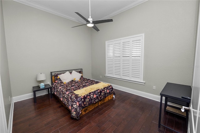 bedroom with dark hardwood / wood-style flooring, ornamental molding, and ceiling fan