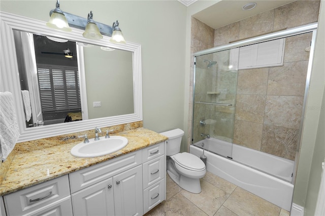 full bathroom with bath / shower combo with glass door, vanity, tile patterned floors, and toilet