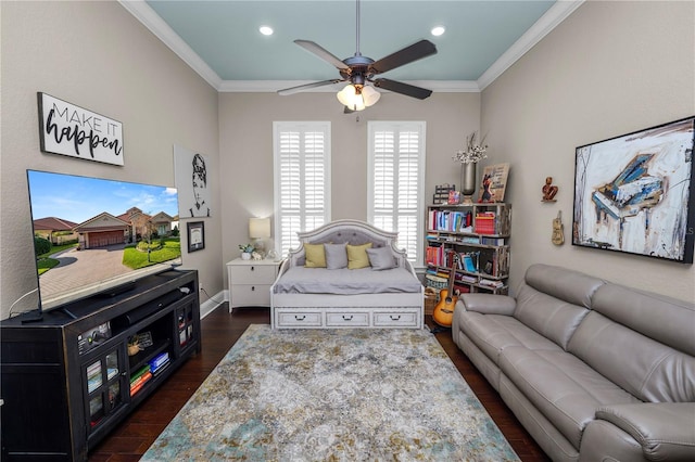 living room featuring ceiling fan, ornamental molding, and dark hardwood / wood-style floors