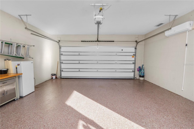 garage featuring a garage door opener and white fridge