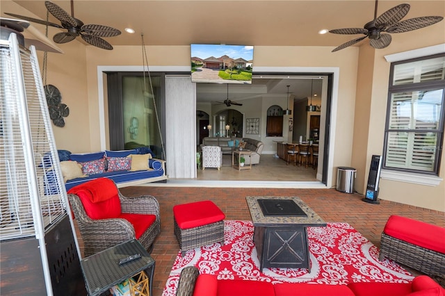 view of patio featuring ceiling fan and an outdoor living space