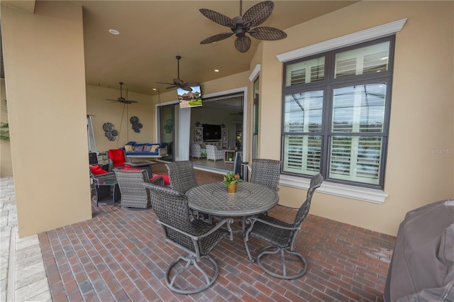 view of patio featuring ceiling fan