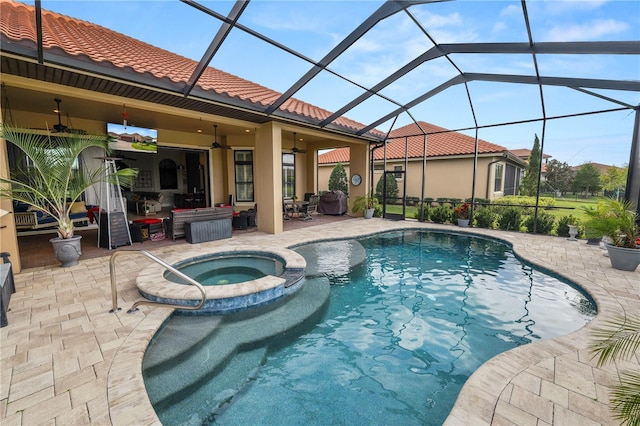 view of swimming pool featuring a lanai, a patio area, ceiling fan, and an in ground hot tub