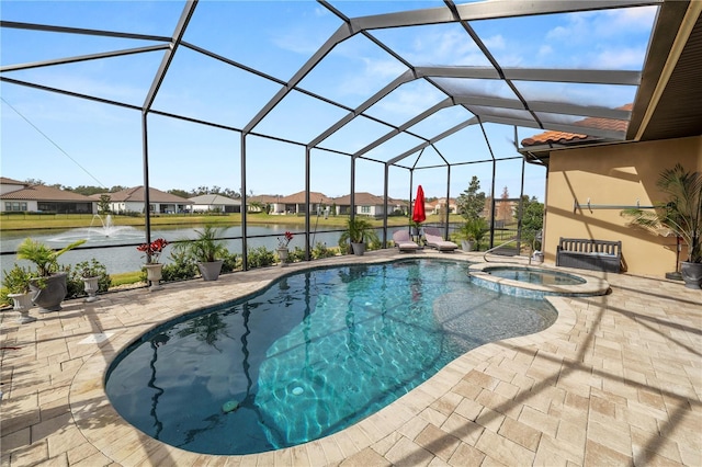 view of swimming pool featuring a water view, an in ground hot tub, a patio area, and glass enclosure