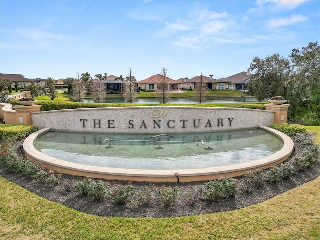 community sign with a water view