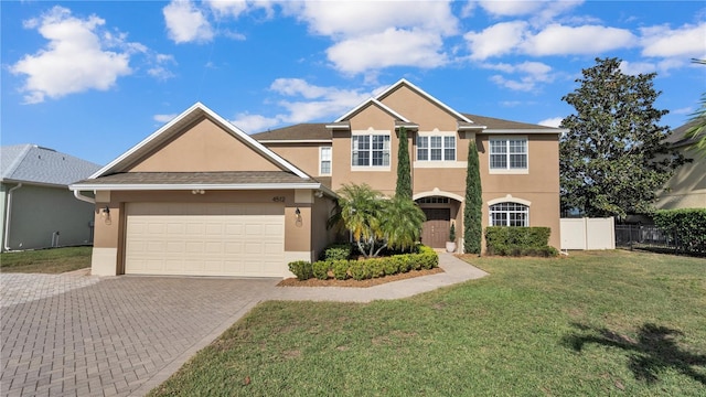 view of front of property with a garage and a front yard