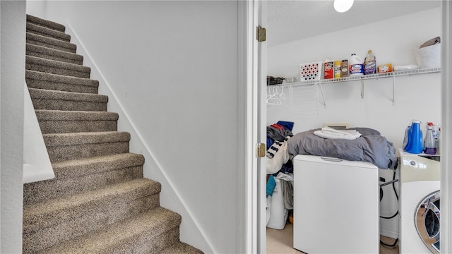 stairway with washer and clothes dryer