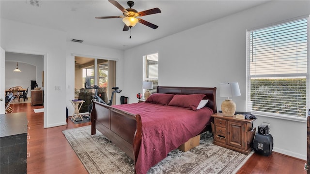 bedroom with hardwood / wood-style floors and ceiling fan