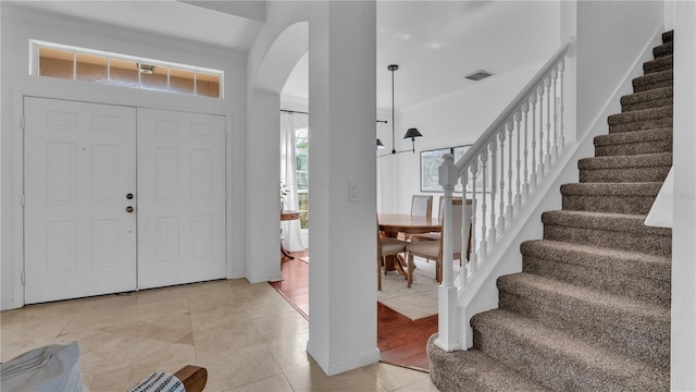 entryway with light tile patterned flooring