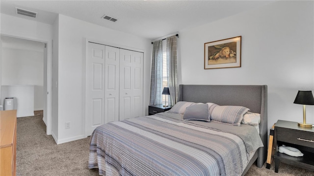 carpeted bedroom with a closet