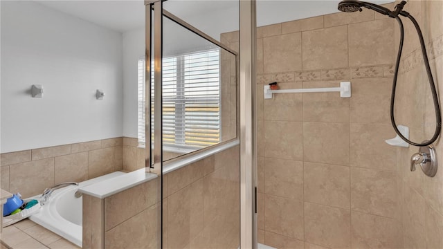 bathroom with shower with separate bathtub