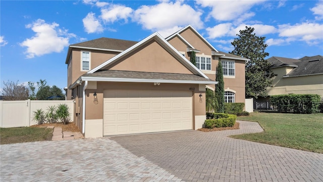 view of front facade featuring a garage and a front yard