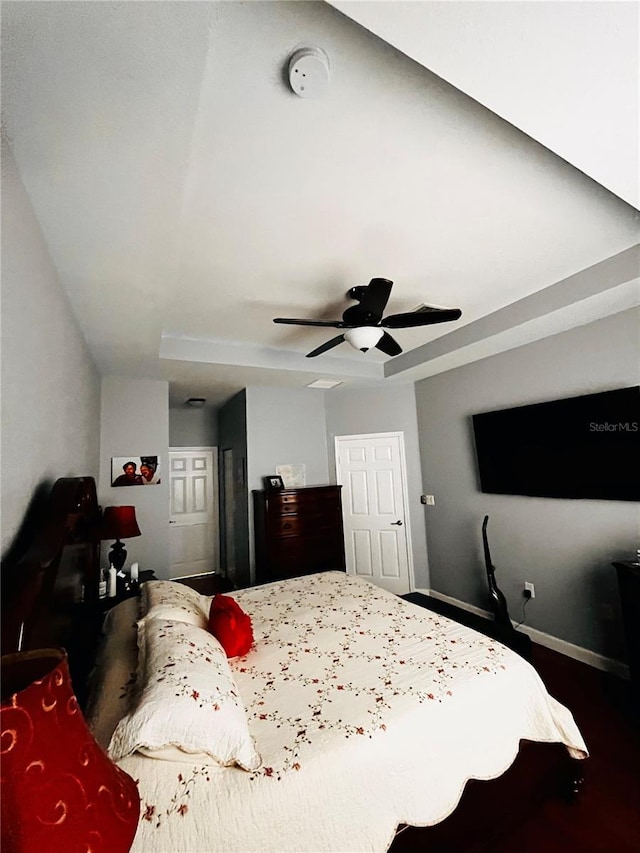 bedroom with hardwood / wood-style flooring and ceiling fan