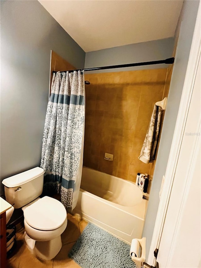 full bathroom featuring tile patterned flooring, vanity, shower / tub combo with curtain, and toilet