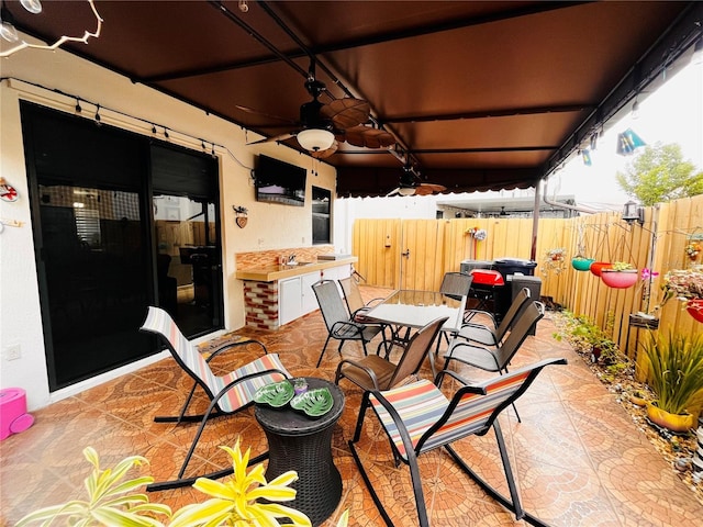 view of patio / terrace with ceiling fan