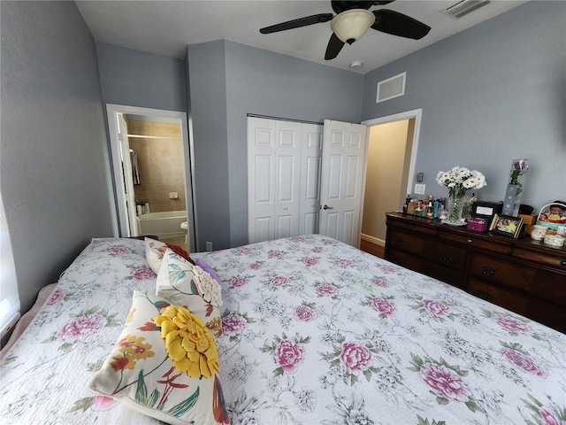 bedroom with a closet, visible vents, connected bathroom, and ceiling fan