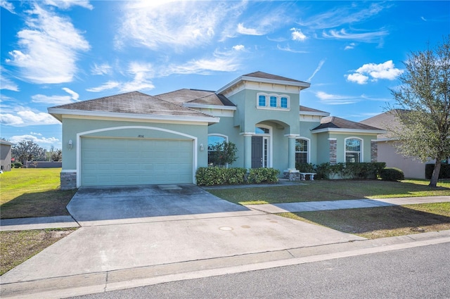 view of front of house with a garage and a front yard