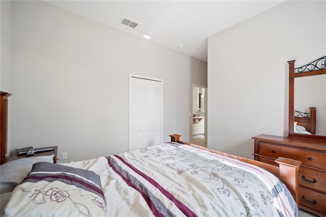 bedroom with a closet and visible vents