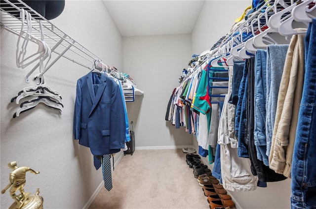 spacious closet with carpet floors