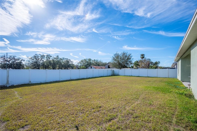 view of yard with a fenced backyard