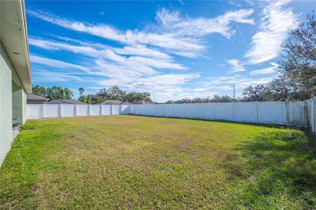 view of yard featuring a fenced backyard