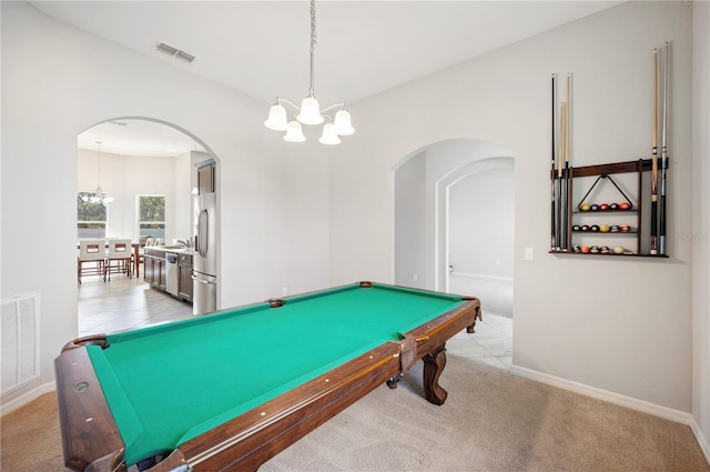 game room with visible vents, arched walkways, a chandelier, and baseboards