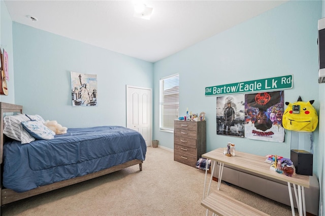 carpeted bedroom featuring a closet