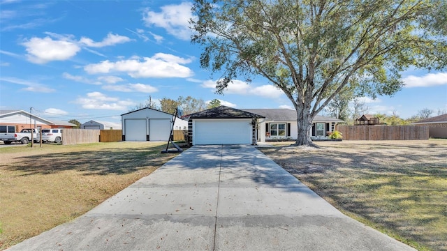 ranch-style house featuring a garage and a front yard