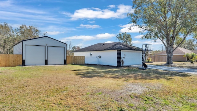 view of yard with an outbuilding and a garage