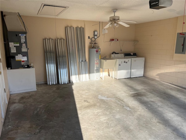 garage featuring a garage door opener, heating unit, separate washer and dryer, electric panel, and electric water heater