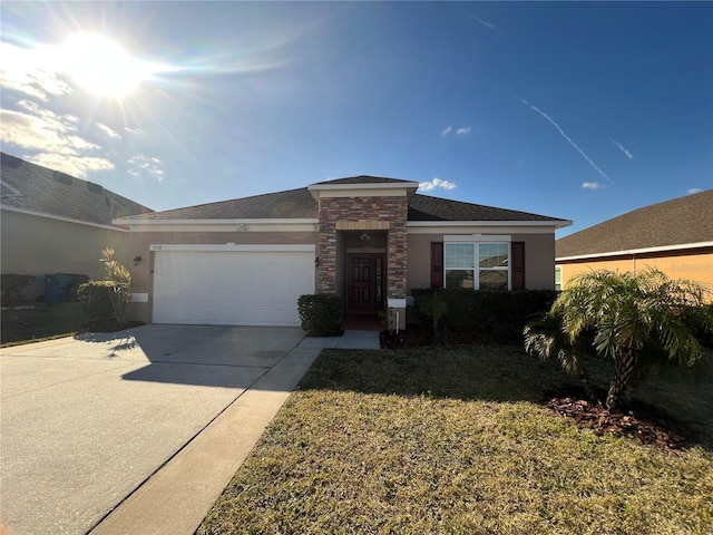 view of front of property featuring a garage and a front yard