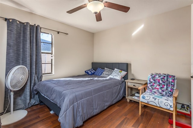 bedroom featuring dark hardwood / wood-style floors and ceiling fan