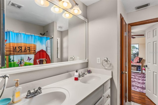 bathroom with vanity and a shower with shower curtain