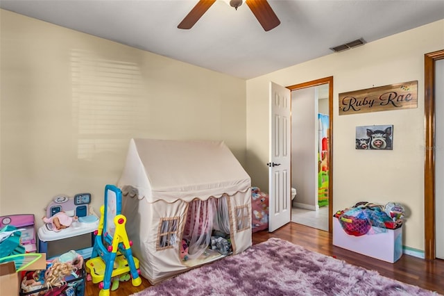 bedroom with dark wood-type flooring and ceiling fan