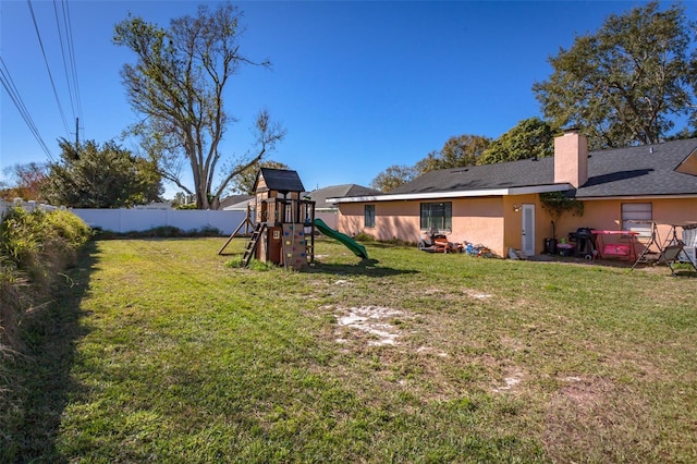 view of yard with a playground