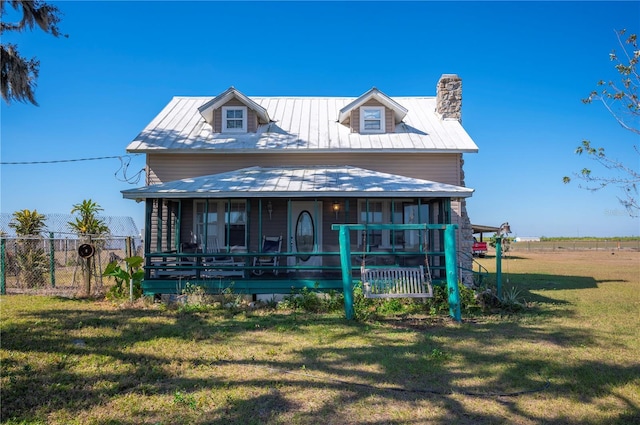 view of front facade featuring a porch and a front yard