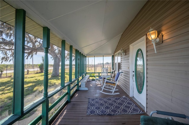 sunroom / solarium with lofted ceiling